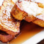 Golden French Toast Delight Drizzled with Maple Syrup