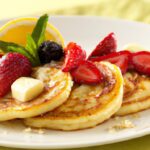 Fluffy Cottage Cheese Pancakes Topped with Fresh Fruit Delight