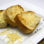 The Irresistible Charm of Cheesy Garlic Bread Unveiled